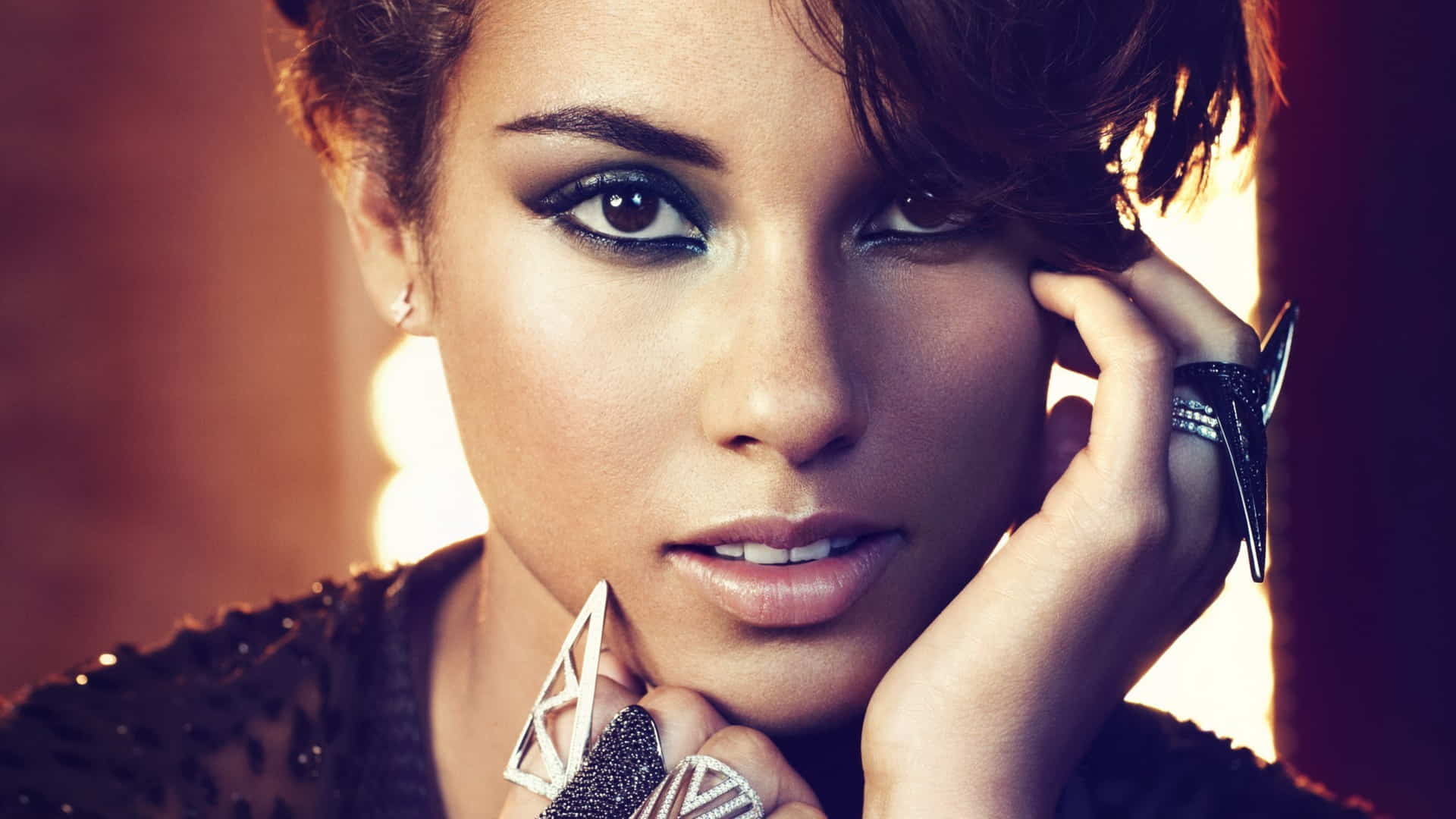 Close up shot of Alicia Keys, with her hair tied up 