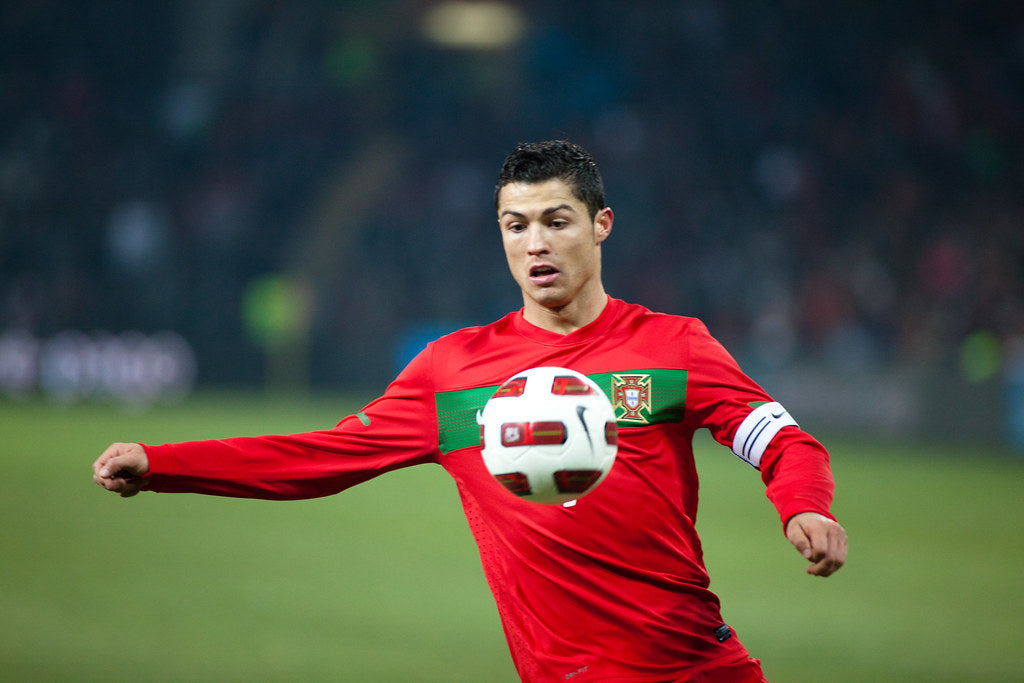 Cristiano Ronaldo playing a football match in the stadium