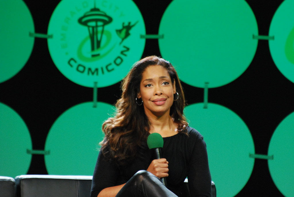 Gina Torres at the comicon addressing the crowd.