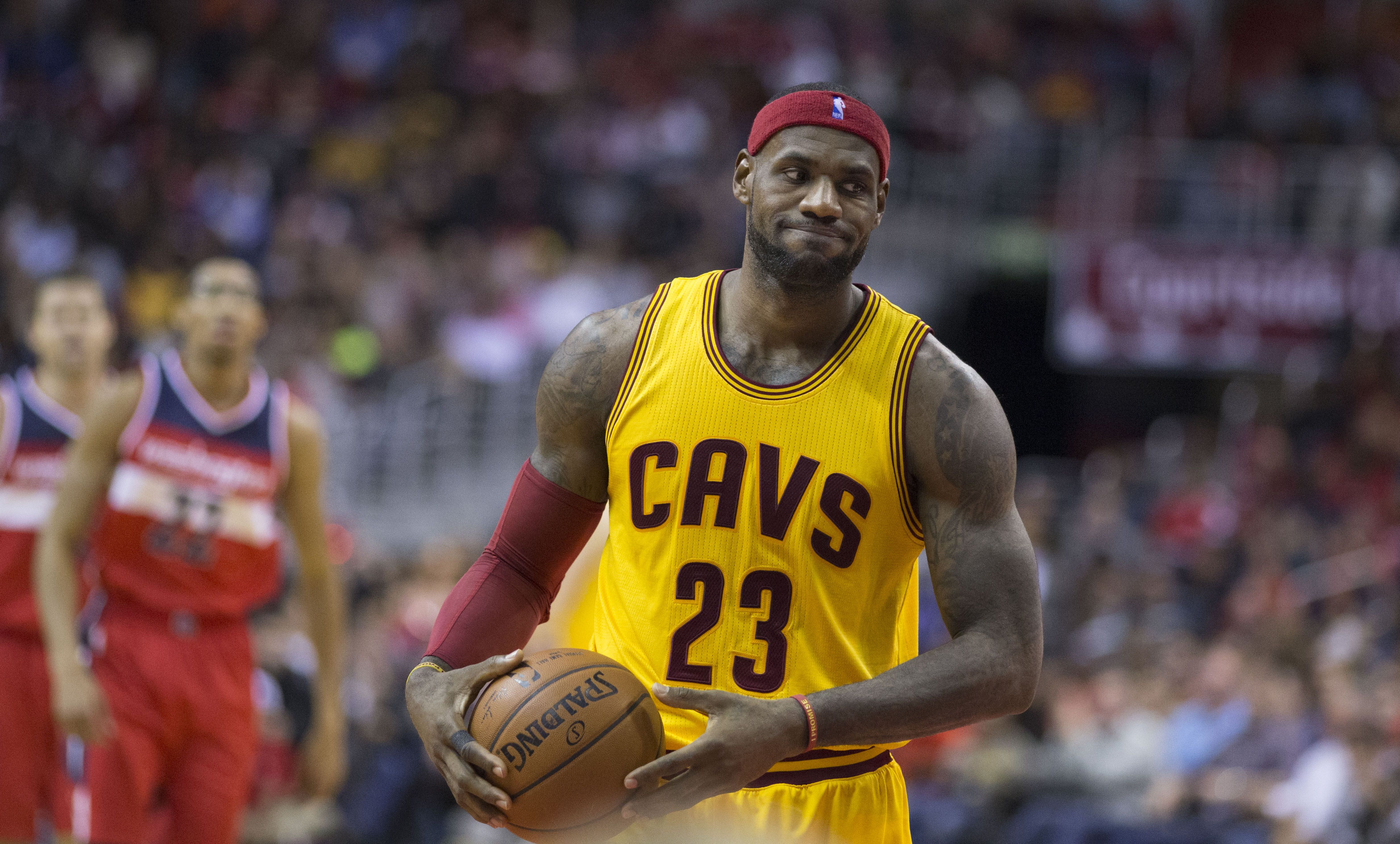 LeBron James with a basketball in hand in a court