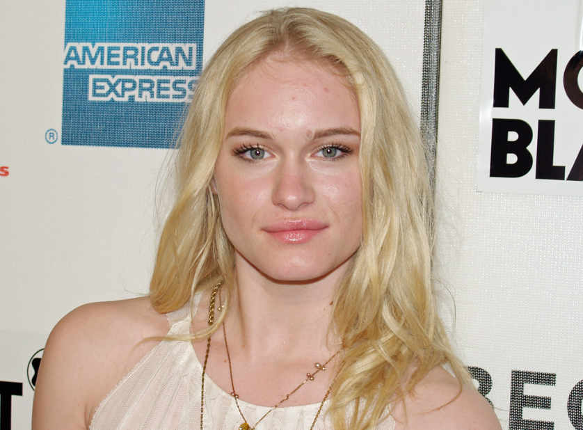 Leven Rambin wearing a white dress and looking at the camera