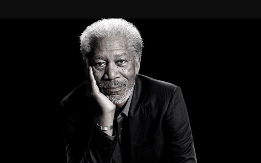A black and white portrait of Morgan Freeman.